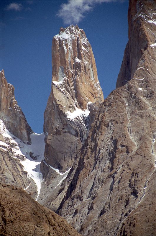 13 Trango Monk And Trango Nameless Tower Close Up From Baltoro Glacier Between Paiju And Khoburtse The Trango Tower (6239 m), commonly called Nameless Tower, is a very large, pointed spire which juts 1000m out of the ridgeline. The Trango Nameless Tower was first climbed in 1976 with Mo Anthoine, Martin Boysen reaching the summit on July 8, 1976 and Joe Brown and Malcolm Howells the next day. The Trango Monk (5850m) is to the left of Trango Nameless Tower.